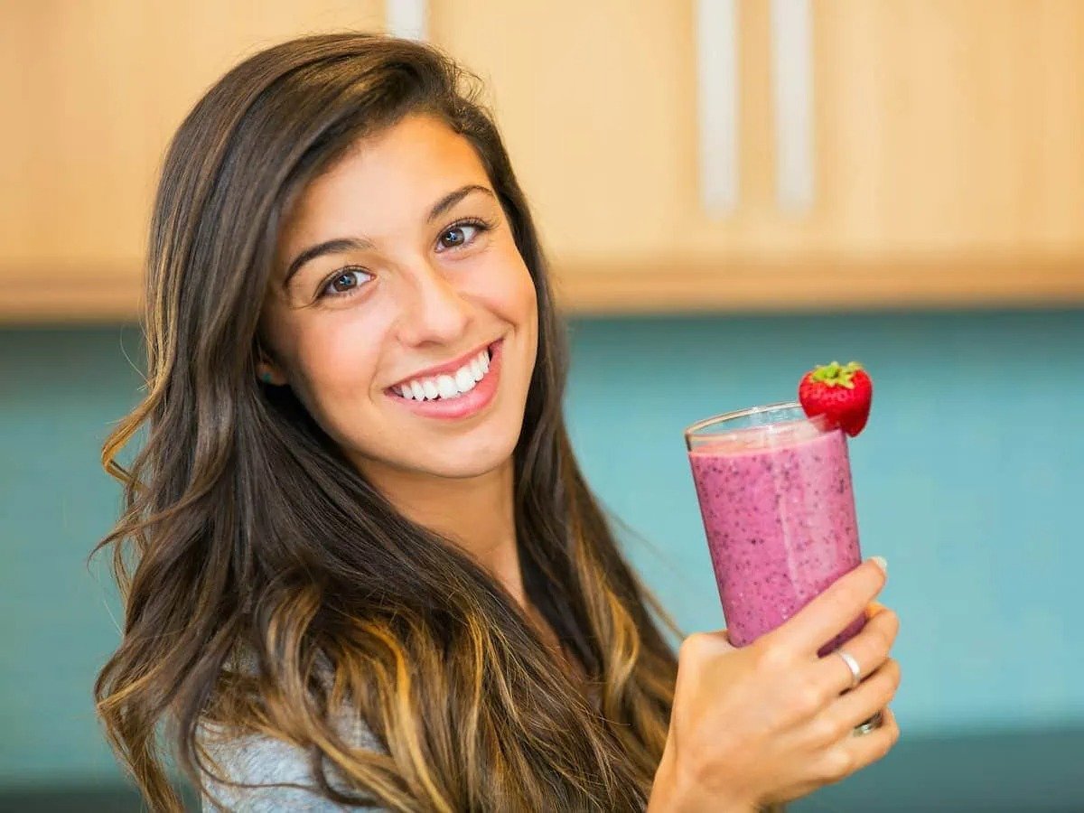 Lady enjoying health benefits of milkshake